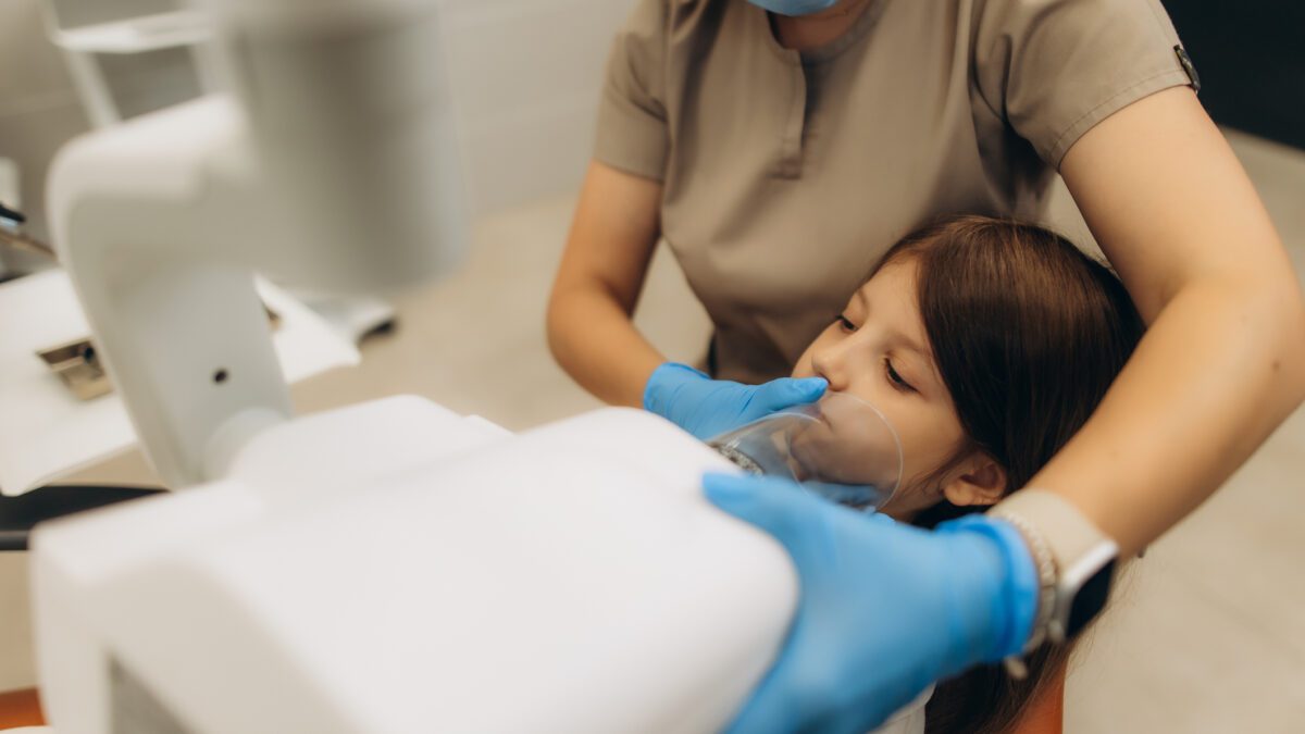 Child undergoing dental sedation
