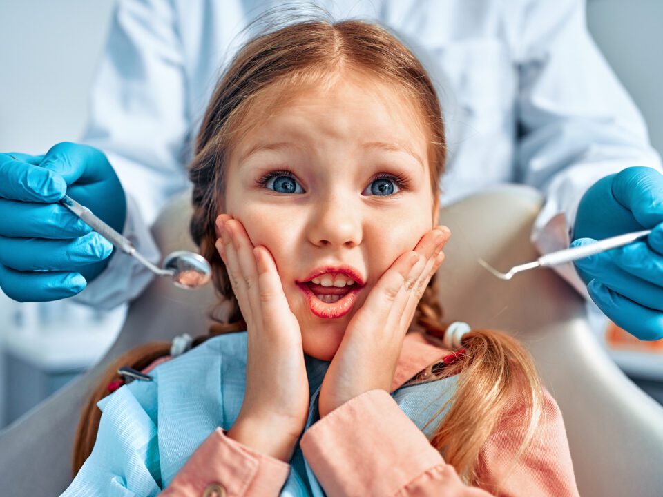 Pediatric dental patient receiving an orthodontic evaluation