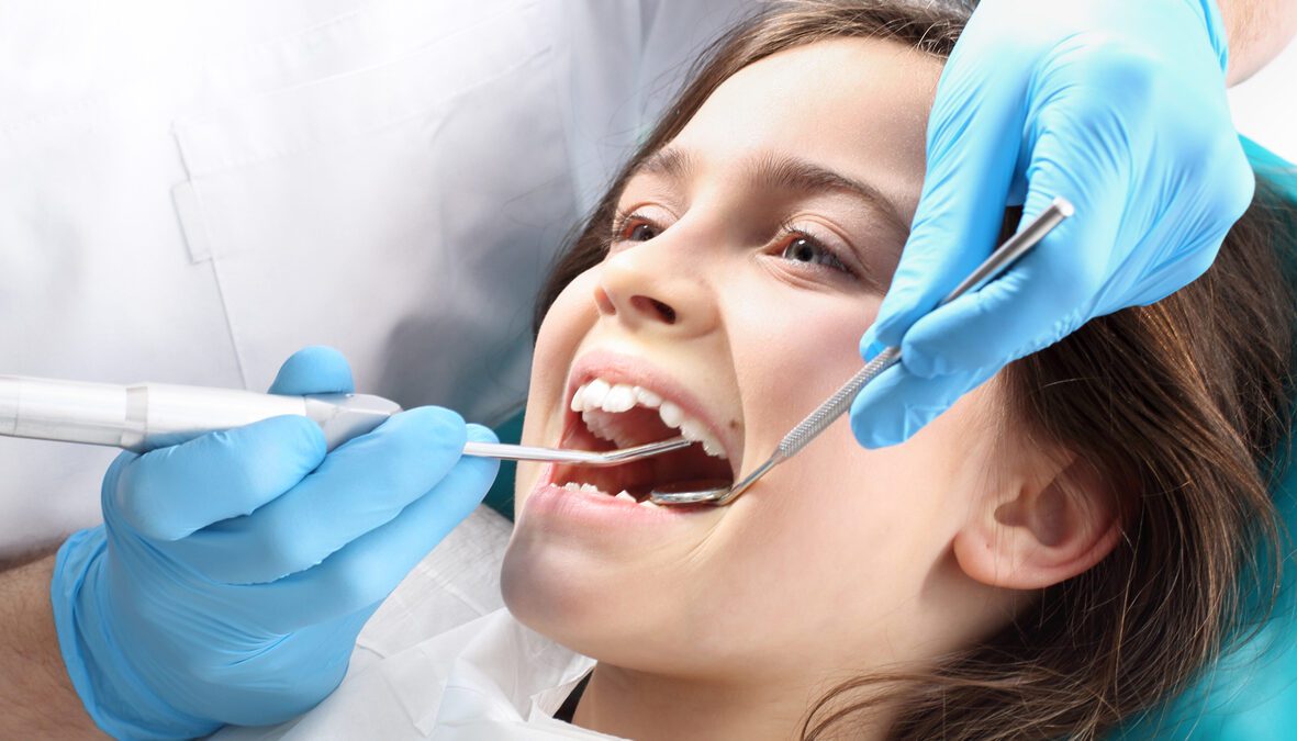 Pediatric patient receiving a dental cleaning