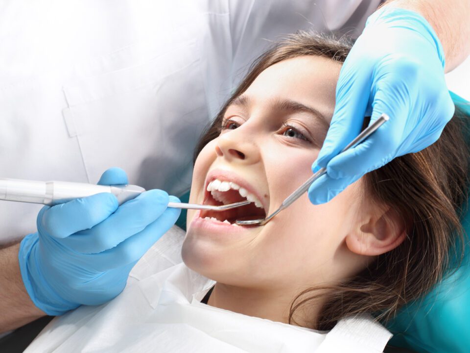 Pediatric patient receiving a dental cleaning